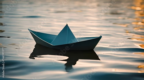 paper boat in choppy water photo