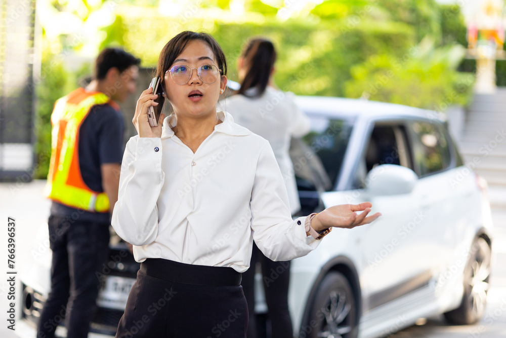 business woman calling to roadside service for help breakdown car on street. roadside assistance and auto insurance service. business woman calling to roadside service for help breakdown car on street. roadside assistance and auto insurance service.