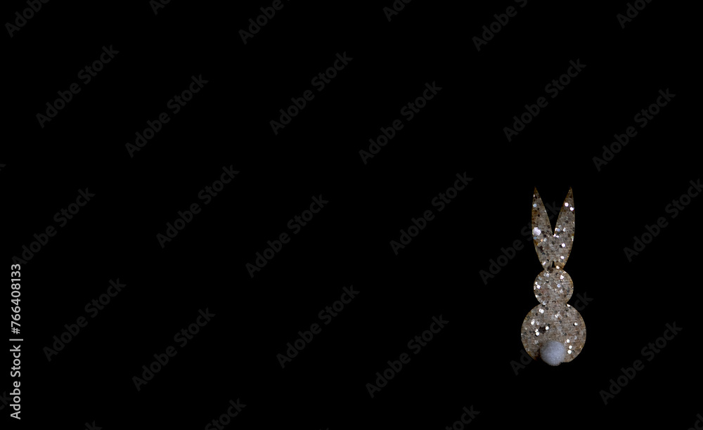 white/gold glitter bunny on a black background white/gold glitter bunny on a black background