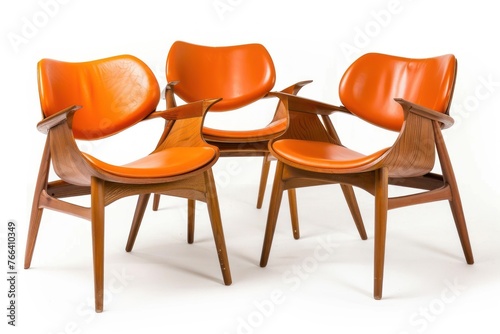 Classic scandinavian mid century modern wood and leather chairs. Retro furniture Isolated on solid white background photo
