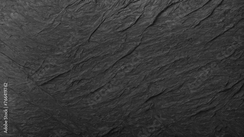 Abstract texture of crumpled black paper. Granite background