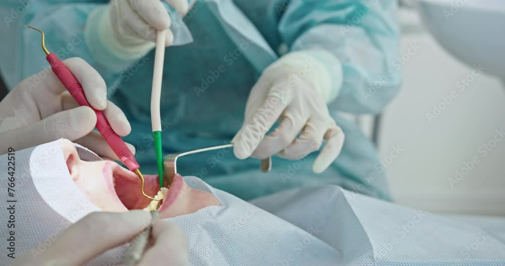 Detailed Dental Work Being Performed with Precision Tools Detailed Dental Work Being Performed with Precision Tools
