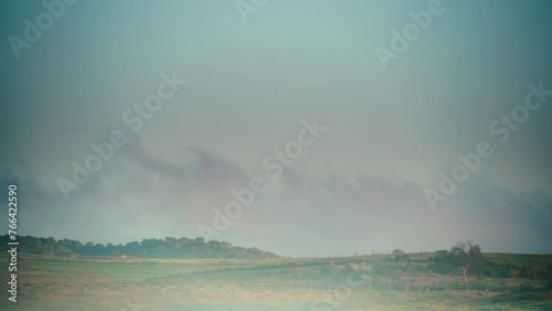 Time lapse of clouds moving over field, countryside autumnal landscape, district of Evora in Portugal Europe. photo