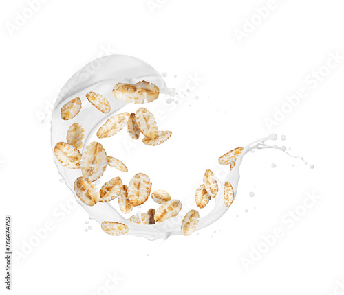 Oat flakes in splashes of milk close up isolated on a white background