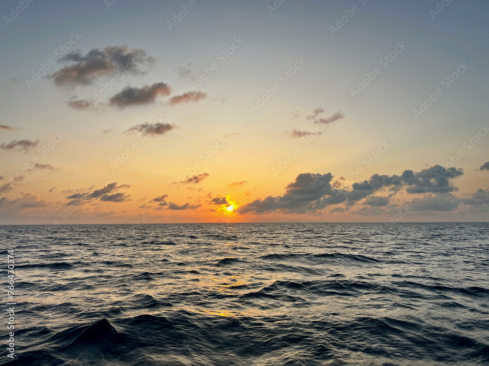 Sunset with clouds in the Indian Ocean
