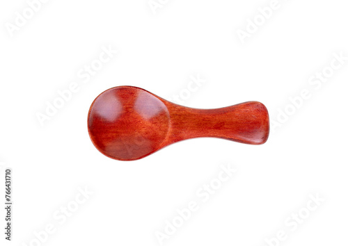 Small red wooden spoon for spice isolated on white background, top view