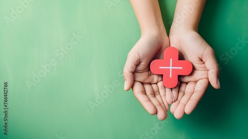heart in hands with green background