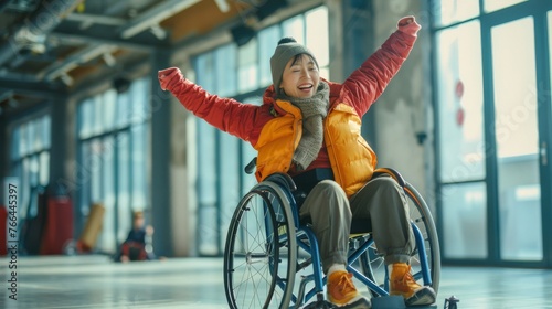 A wheelchair user participating in a wheelchair dance class, expressing themselves through movement and music