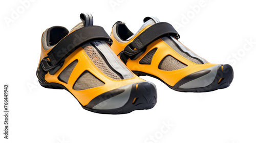 A vibrant pair of yellow and black shoes standing out against a clean white background