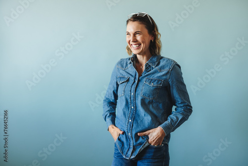 Business woman celebrating her success in denim clothing photo