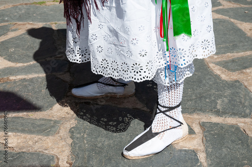 Los pies calzados con zapatillas tradicionales de un danzante de Majaelrayo, Guadalajara, España. photo