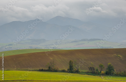 Mountain landscape. In the foreground, a farmland . In the distance you can see the Low Tatras Zilina Region. Liptovske Matiasovce. Slovakia.