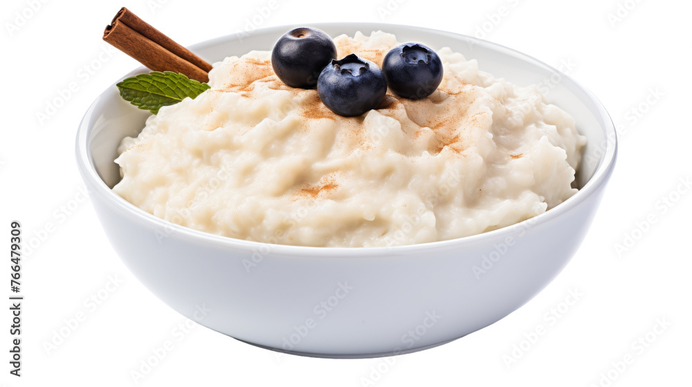 Bowl of mashed potatoes adorned with blueberries and cinnamon sticks Bowl of mashed potatoes adorned with blueberries and cinnamon sticks