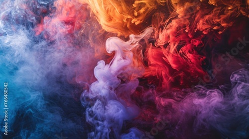 A colorful abstract composition of billowing smoke in red, blue and purple colors. The smoke forms an intricate pattern on a black background.
