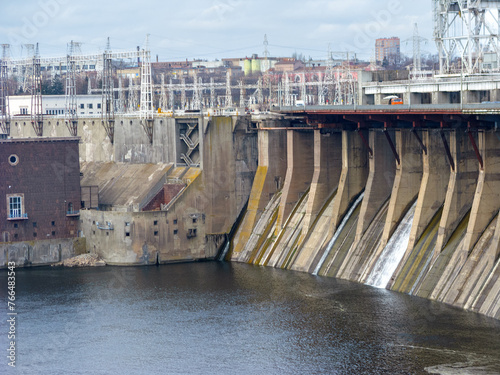 Dnieper Hydroelectric Power Station ogee shaped spillways with light waterjets streaming down the dam, Zaporizhzhya, Ukraine. HES-1 and dam  were built in the USSR with American help between 1927-1932