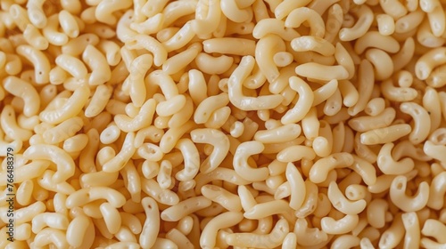 Close up of a pile of macaroni noodles, perfect for food-related designs