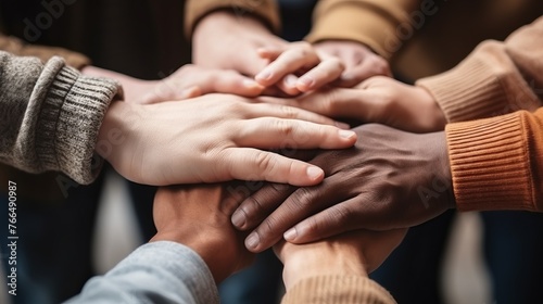 A group of diverse people joining their hands together