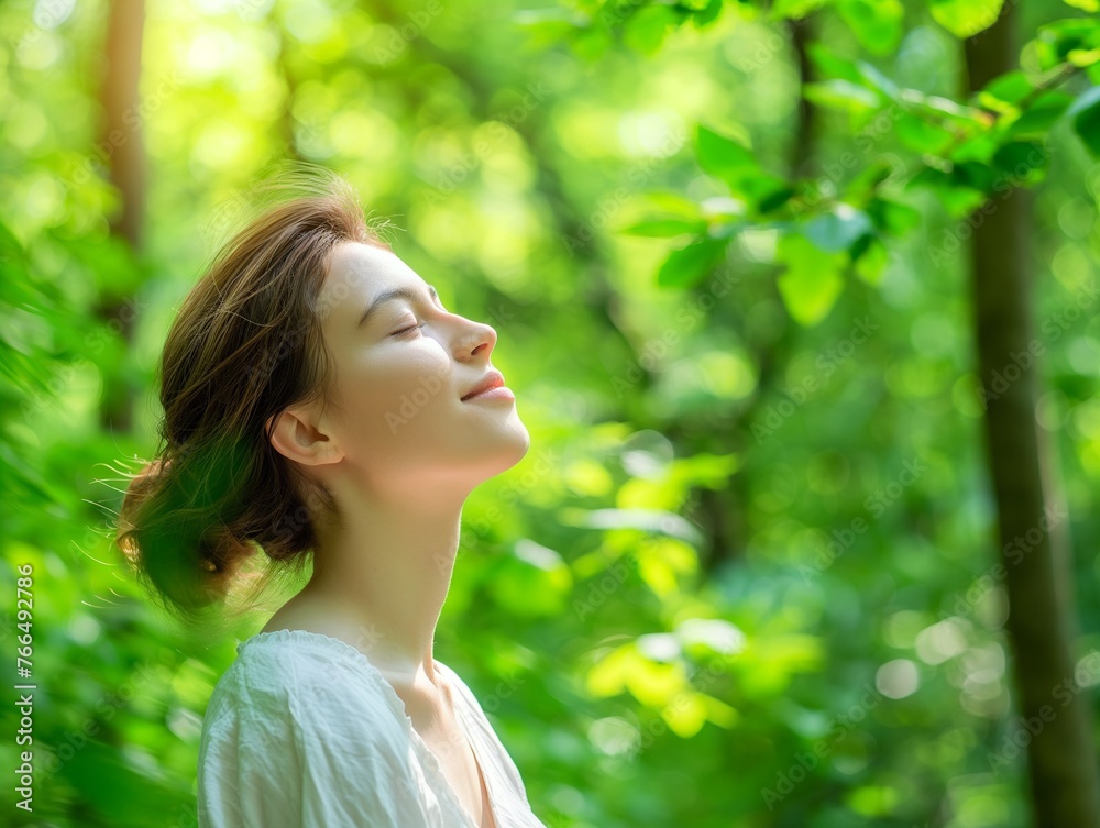 happy woman relaxing in park. Joyful female model breathing fresh air outdoors happy woman relaxing in park. Joyful female model breathing fresh air outdoors