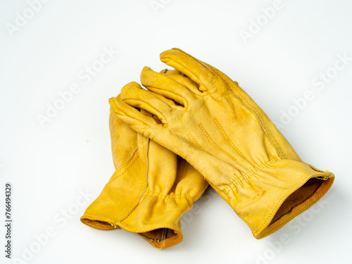 Pair of leather gloves on a white background