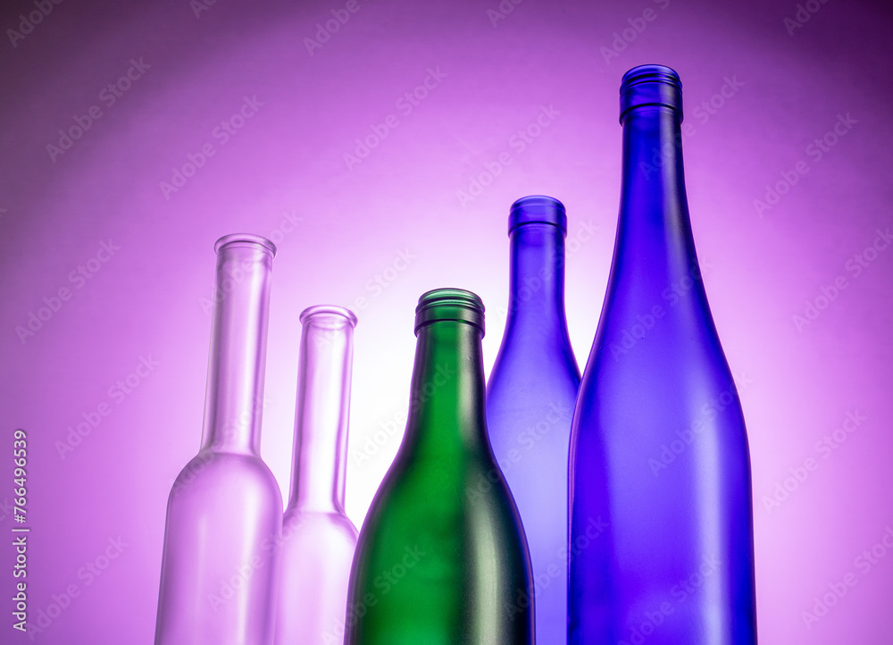 Elegant glassware displayed on mesmerizing glowing gradient background Elegant glassware displayed on mesmerizing glowing gradient background