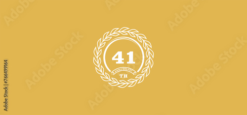 41st anniversary logo with ring and frame, white color and gold background photo