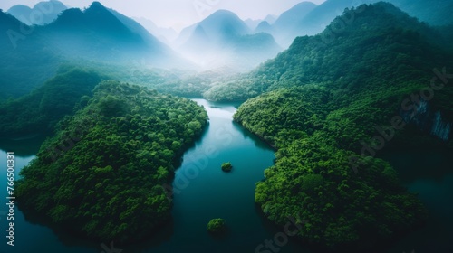 A drone show of a mountain river engulfed in mist