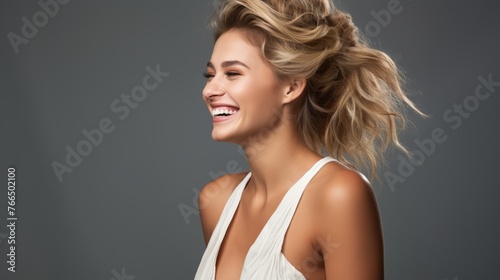 Portrait of a beautiful blonde woman laughing