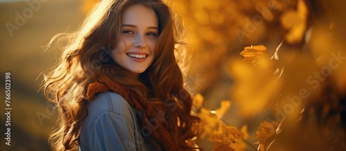 A jovial woman with vibrant, flowing red hair showcasing a wide smile and radiating happiness