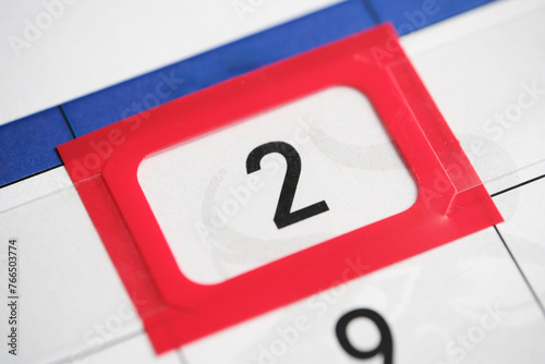 Calendar date. The 2th number the calendar is highlighted in a red frame. photo