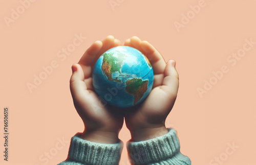 A pair of small hands cradling a miniature globe wrapped in cozy knitted material, conveying care and protection for the planet
