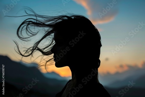Woman Silhouetted Against Sky in Early Evening Twilight as the Wind Blows her Hair. Generative AI. 