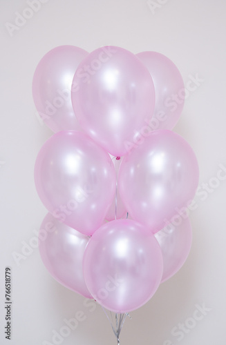 pearlescent pink balloons on white background
