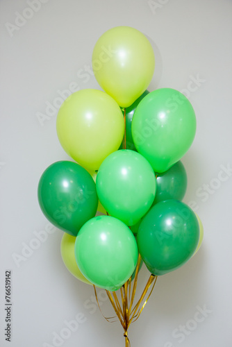 a bunch of green balloons for the holiday