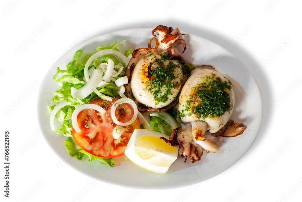 Grilled squid served with lemon and vegetables Grilled squid served with lemon and vegetables