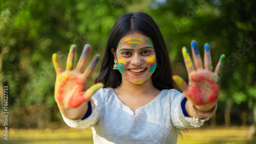 Woman celebrating Holi festival with powder colours or gulal  Holi celebration outdoor