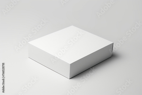 Single empty magnet white cardboard box with blank label on a solid white background, box slightly open to reveal the empty interior, © Khurram