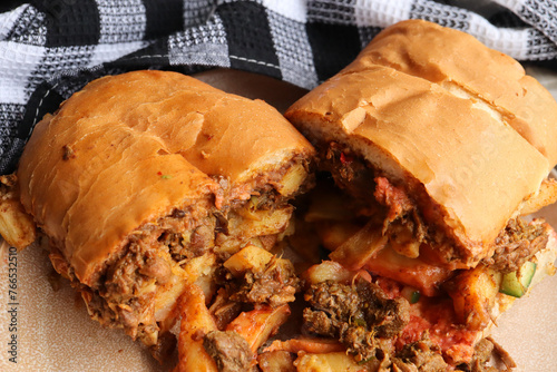 Masala steak gatsby. South African fast food called a Gatsby. Large bread roll usually fill with chips and meat. 