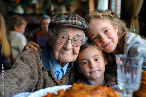 Cherish family moments with this heartfelt image of a grandfather lovingly surrounded by his granddaughters, capturing the essence of joy and familial bonds.
