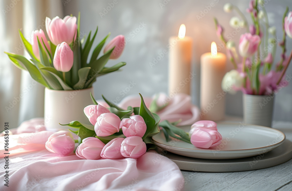 Beautifull pink spring tulips, ceramic tableware anfd candles