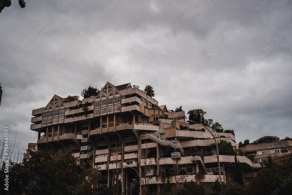 large tall apartment building with trees large tall apartment building with trees