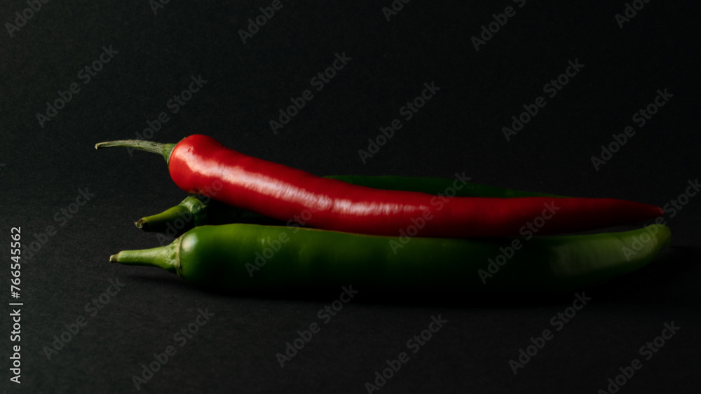 hot chili peppers on black background