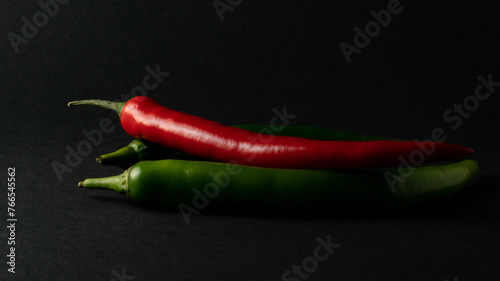 hot chili peppers on black background