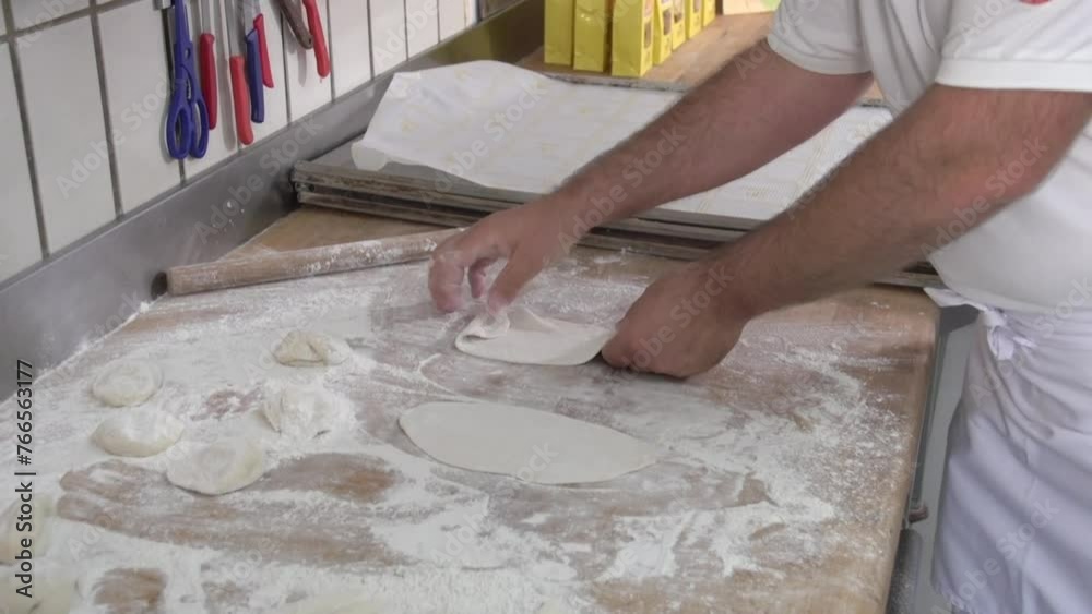baker baking pastries and bread in bakery baker baking pastries and bread in bakery