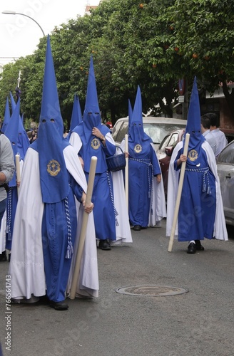 Blue Penitents in a religious procession during the Holy Week in Seville, Spain