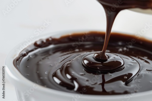 Pure Chocolate Sauce Flowing with Drips. Macro Melted White Sweet Snack