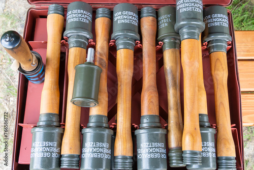 German WW2 wooden handle hand grenades in an ammunition box photo