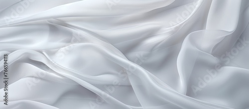 Capturing the intricate details, this image shows a tightly folded white fabric, creating a mesmerizing texture.