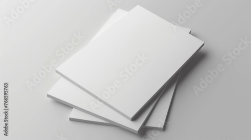 A stack of white paper on a table. Suitable for office or education concepts