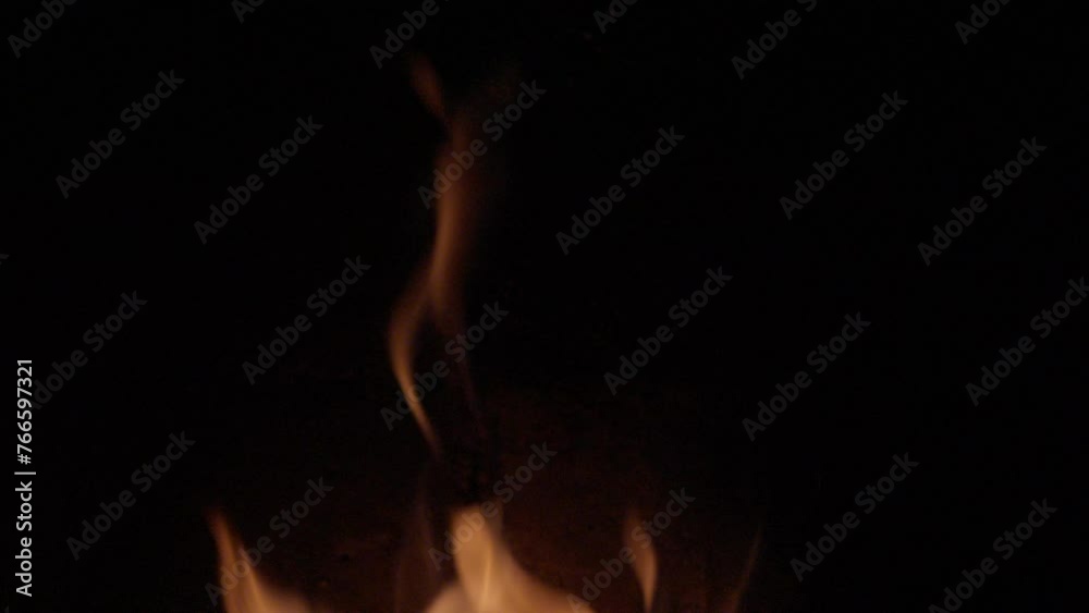 Charming campfire in slow motion.Lots of sparks flames tongues from burning logs Charming campfire in slow motion.Lots of sparks flames tongues from burning logs