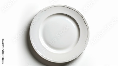 A minimalist white plate on a clean white background. Perfect for food and kitchen-related designs